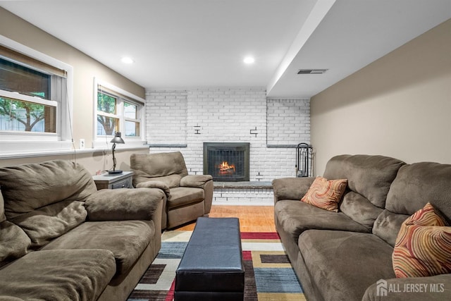 17 4th St, South River, NJ 08882 - living area with a fireplace, wood finished floors, and recessed lighting