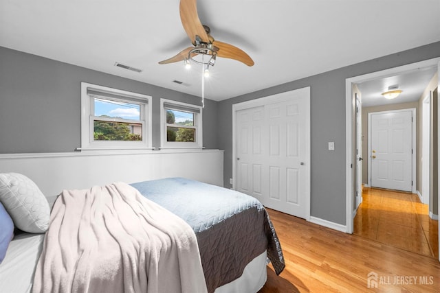 17 4th St, South River, NJ 08882 - bedroom with light wood-style floors, baseboards, a closet, and ceiling fan