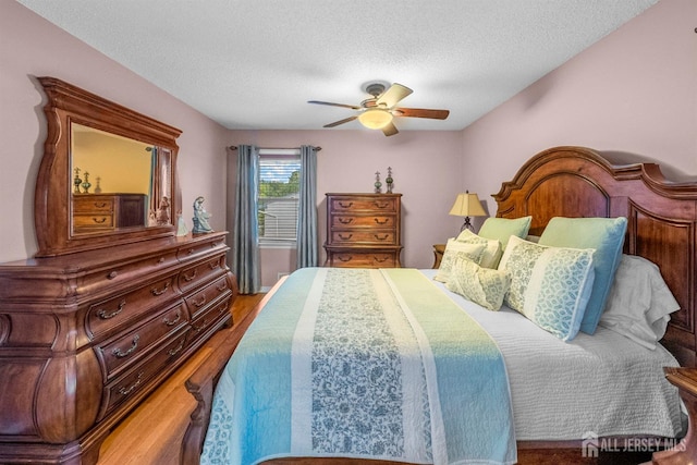 17 4th St, South River, NJ 08882 - bedroom with a textured ceiling, wood finished floors, and a ceiling fan