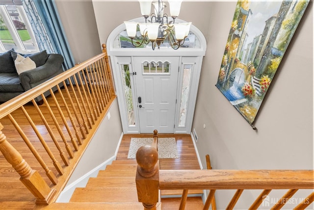17 4th St, South River, NJ 08882 - entryway with wood finished floors, a chandelier, and stairway