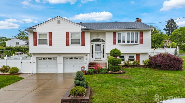 17 4th St, South River, NJ 08882 - split foyer home featuring a garage, a chimney, driveway, and roof with shingles