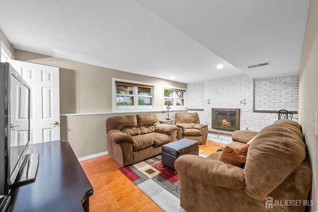 17 4th St, South River, NJ 08882 - living room featuring plenty of natural light, a fireplace, light wood-style flooring, recessed lighting, and baseboards