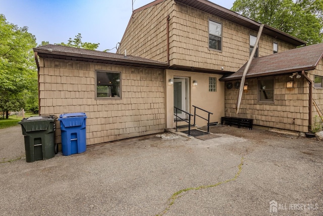 170 Jordon Rd, Colonia, NJ 07067 - back of property featuring a shingled roof and a patio