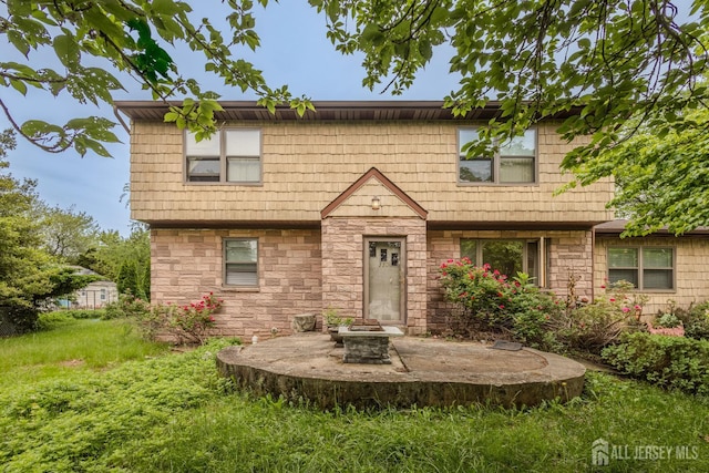 170 Jordon Rd, Colonia, NJ 07067 - view of front of property with stone siding and an outdoor fire pit