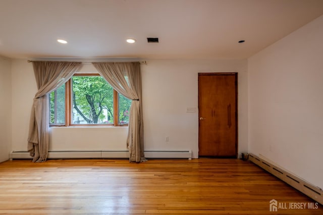 170 Jordon Rd, Colonia, NJ 07067 - spare room featuring baseboard heating, wood finished floors, recessed lighting, and a baseboard radiator