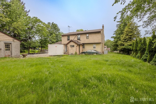 170 Jordon Rd, Colonia, NJ 07067 - rear view of property with a chimney