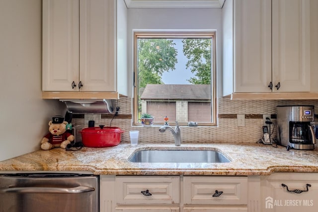 170 Jordon Rd, Colonia, NJ 07067 - kitchen with a sink, stainless steel dishwasher, tasteful backsplash, ornamental molding, and white cabinets