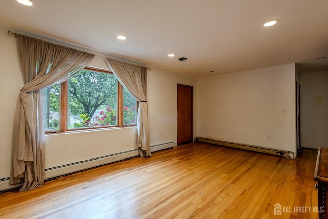 170 Jordon Rd, Colonia, NJ 07067 - empty room with a baseboard radiator, light wood-style floors, and recessed lighting