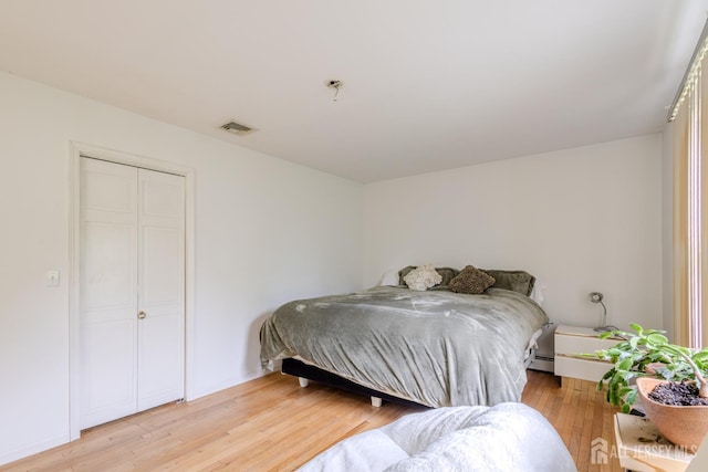 170 Jordon Rd, Colonia, NJ 07067 - bedroom featuring light wood-style flooring, baseboards, and baseboard heating