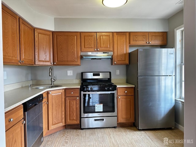 158 Mill Run, Hightstown, NJ 08520 - kitchen featuring stainless steel appliances, under cabinet range hood, a sink, brown cabinets, and light countertops