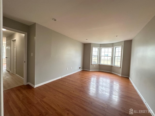 158 Mill Run, Hightstown, NJ 08520 - spare room with wood finished floors and baseboards