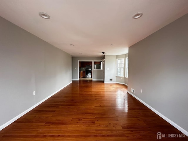 158 Mill Run, Hightstown, NJ 08520 - unfurnished living room with baseboards, wood finished floors, and recessed lighting
