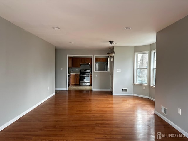 158 Mill Run, Hightstown, NJ 08520 - unfurnished living room with wood finished floors, baseboards, and recessed lighting