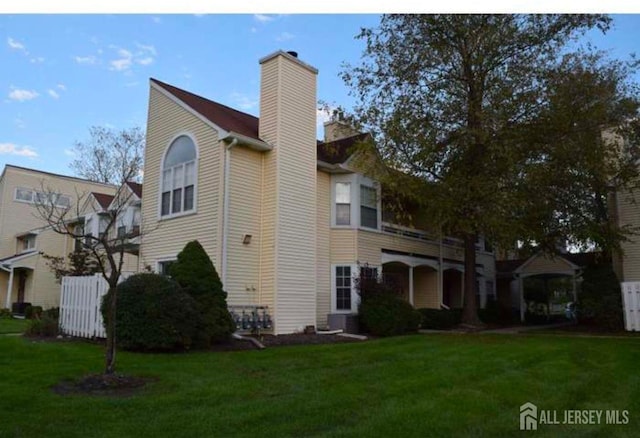 158 Mill Run, Hightstown, NJ 08520 - view of home's exterior with a chimney and a yard