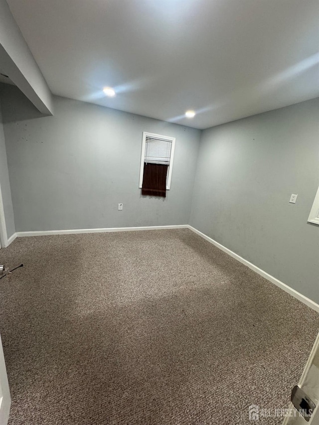 basement featuring carpet and baseboards