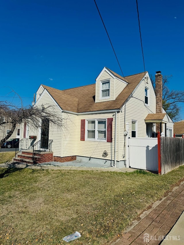 view of front of property featuring roof with shingles