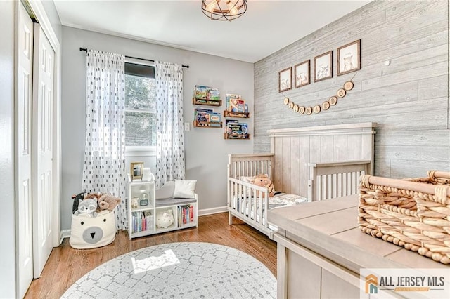 35 Outcalt Rd, Edison, NJ 08817 - bedroom featuring baseboards, an accent wall, a closet, and wood finished floors