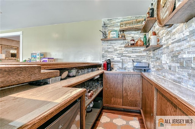 35 Outcalt Rd, Edison, NJ 08817 - interior space with a sink, bar, decorative backsplash, and wood finished floors