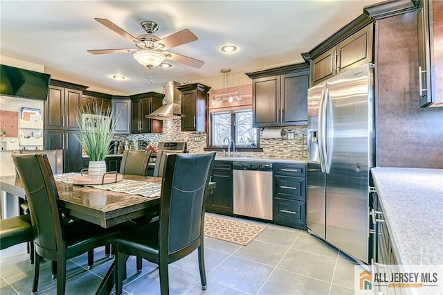 35 Outcalt Rd, Edison, NJ 08817 - kitchen featuring wall chimney range hood, dark brown cabinets, appliances with stainless steel finishes, and light countertops