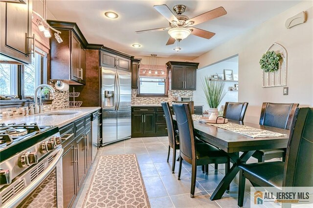 35 Outcalt Rd, Edison, NJ 08817 - kitchen with a sink, dark brown cabinetry, tasteful backsplash, a ceiling fan, and appliances with stainless steel finishes
