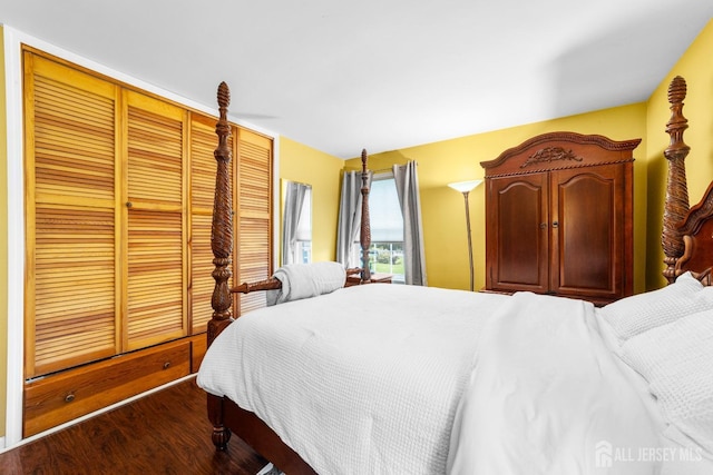 bedroom featuring dark wood-style flooring