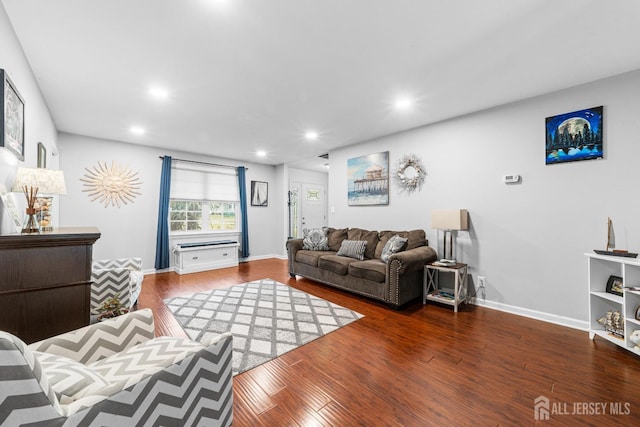 living area with wood finished floors, baseboards, and recessed lighting