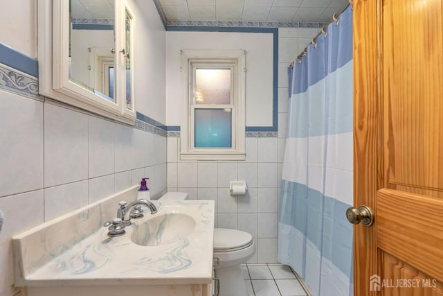 2347 Linden Ave, South Plainfield, NJ 07080 - bathroom featuring toilet, tile walls, tile patterned flooring, vanity, and curtained shower