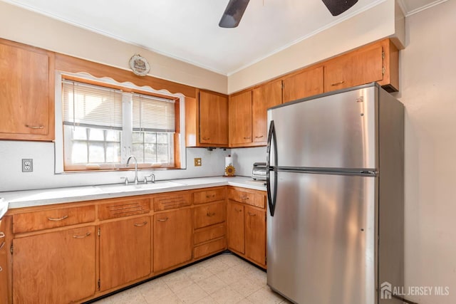 2347 Linden Ave, South Plainfield, NJ 07080 - kitchen featuring freestanding refrigerator, a sink, a ceiling fan, light countertops, and crown molding