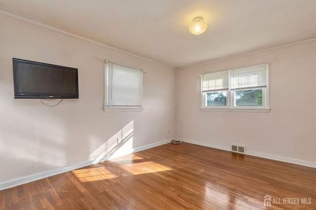 2347 Linden Ave, South Plainfield, NJ 07080 - spare room featuring baseboards, wood-type flooring, and ornamental molding