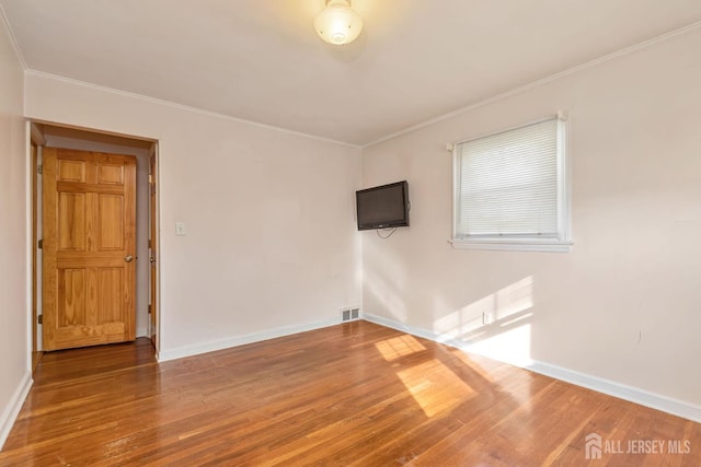 2347 Linden Ave, South Plainfield, NJ 07080 - empty room featuring crown molding, wood finished floors, and baseboards