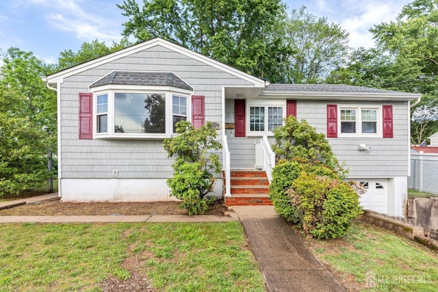 2347 Linden Ave, South Plainfield, NJ 07080 - view of front facade featuring an attached garage and roof with shingles
