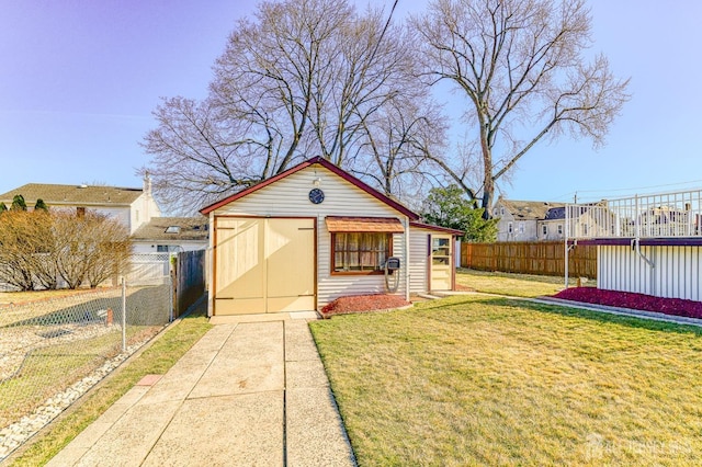 view of outbuilding with fence