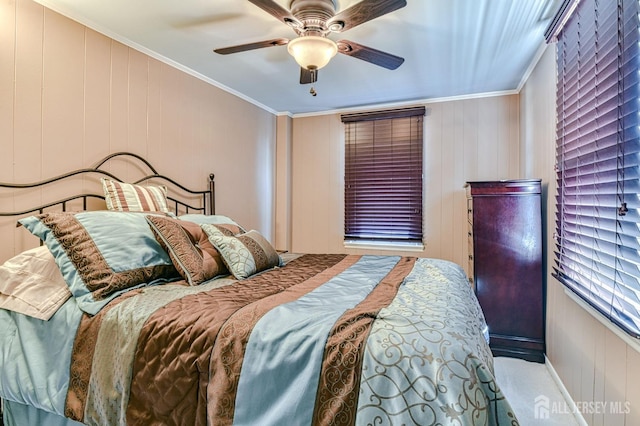 bedroom featuring a ceiling fan and crown molding