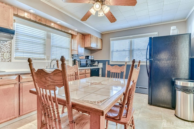 dining room featuring ceiling fan, light tile patterned floors, baseboard heating, and ornamental molding