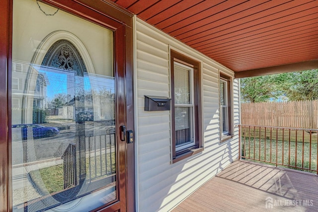 doorway to property featuring covered porch