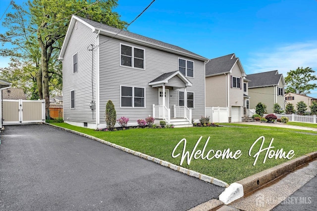 64 2nd Ave, Port Reading, NJ 07064 - view of front facade featuring driveway and a gate