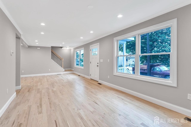 64 2nd Ave, Port Reading, NJ 07064 - entryway featuring crown molding, baseboards, stairway, light wood-type flooring, and recessed lighting