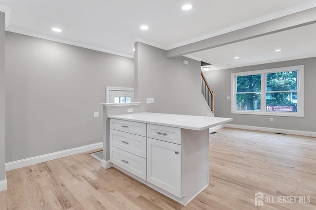 64 2nd Ave, Port Reading, NJ 07064 - kitchen featuring ornamental molding, light wood-style flooring, light stone counters, white cabinetry, and recessed lighting