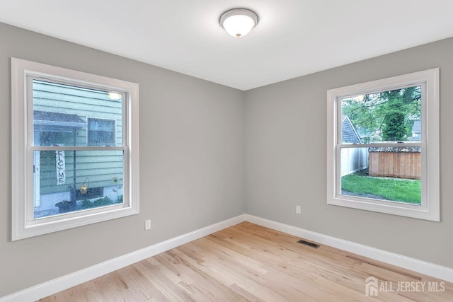 64 2nd Ave, Port Reading, NJ 07064 - unfurnished room with baseboards and light wood finished floors