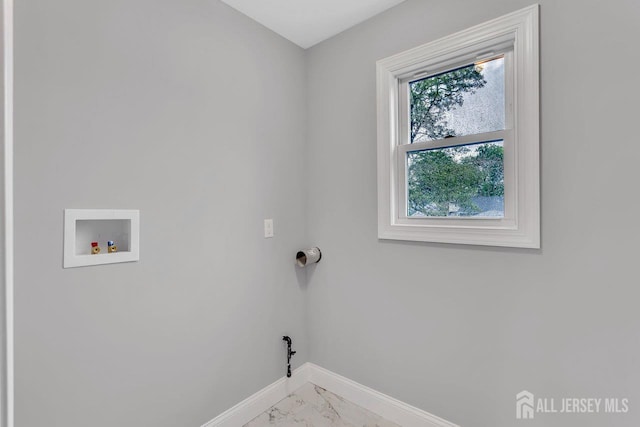 64 2nd Ave, Port Reading, NJ 07064 - laundry room with baseboards, light marble finish floors, and washer hookup