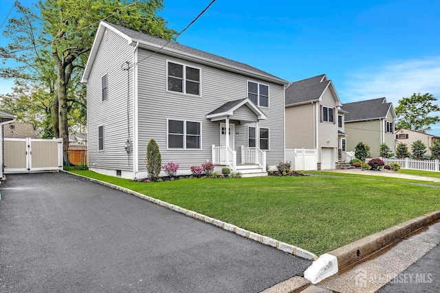 64 2nd Ave, Port Reading, NJ 07064 - view of front facade with driveway and a gate