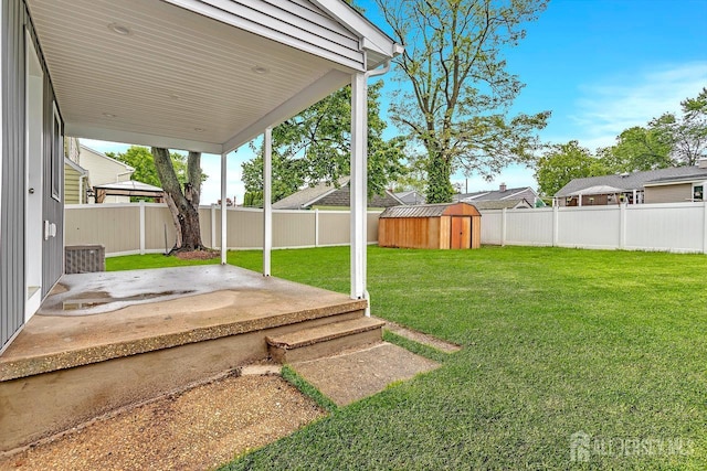 64 2nd Ave, Port Reading, NJ 07064 - fenced backyard featuring a patio area and a storage unit