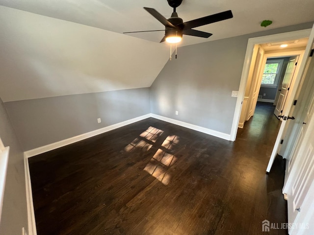 bonus room featuring ceiling fan, dark hardwood / wood-style flooring, and lofted ceiling