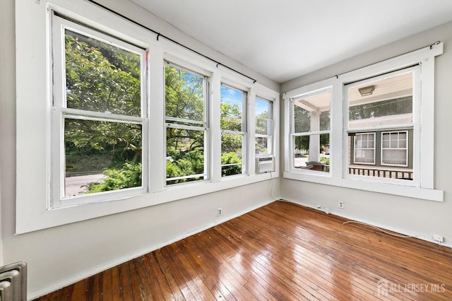 unfurnished sunroom with radiator