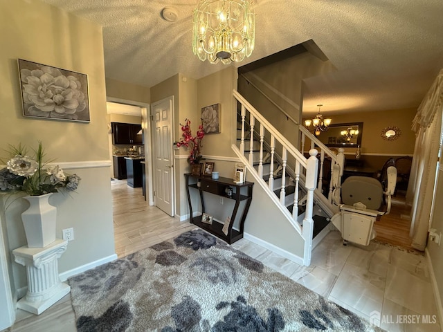 4 Hemlock Hill Rd, Jackson, NJ 08527 - entryway with a chandelier, a textured ceiling, and stairs