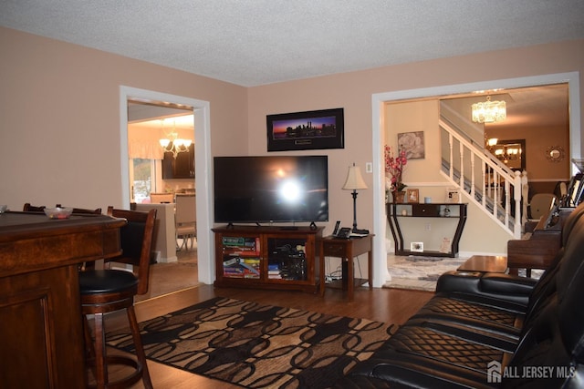 4 Hemlock Hill Rd, Jackson, NJ 08527 - living room with a chandelier, stairway, wood finished floors, and a textured ceiling