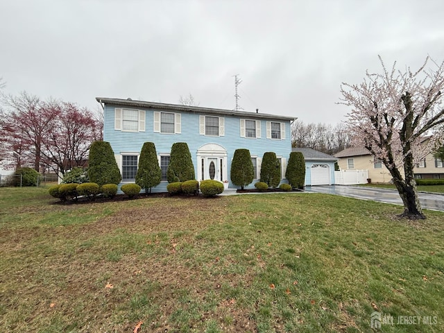 4 Hemlock Hill Rd, Jackson, NJ 08527 - colonial inspired home with asphalt driveway, a front lawn, and a detached garage