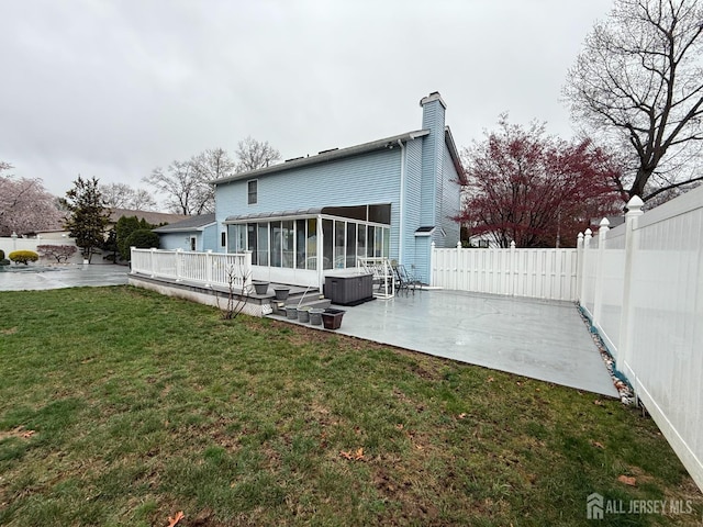 4 Hemlock Hill Rd, Jackson, NJ 08527 - back of house featuring a sunroom, a patio area, a chimney, a fenced backyard, and a deck
