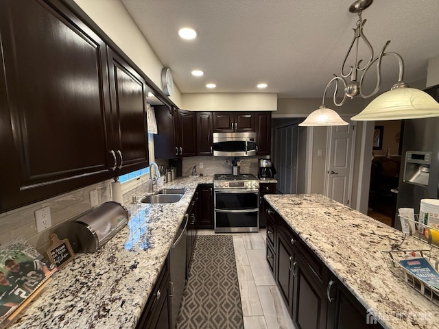 4 Hemlock Hill Rd, Jackson, NJ 08527 - kitchen with stainless steel appliances, light stone counters, tasteful backsplash, pendant lighting, and recessed lighting