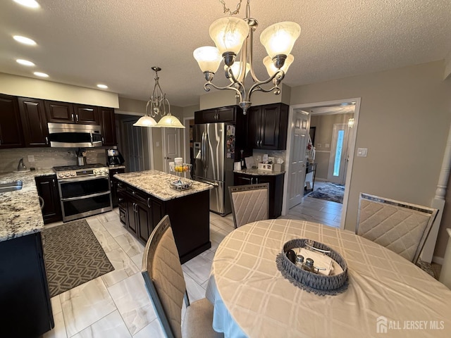 4 Hemlock Hill Rd, Jackson, NJ 08527 - kitchen featuring stainless steel appliances, a chandelier, recessed lighting, a kitchen island, and tasteful backsplash